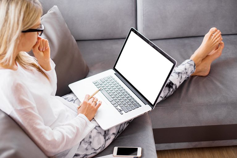 woman sitting down with a computer